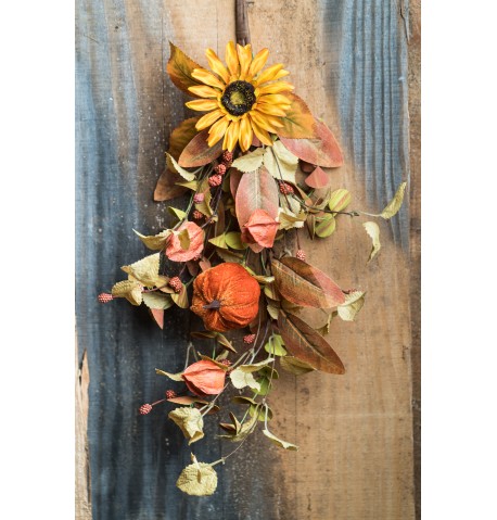 Koriste-oksa auringonkukilla ja kurpitsoilla